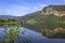 A typical idyllic landscape in Norway. The forest and the mountains are reflected in the water