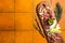 Typical italian antipasto, Cheese and meat plate with Prosciutto ham, Parmesan, Blue cheese, Melon and Olives on wooden