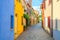 Typical italian cobblestone street with colorful multicolored buildings, traditional houses in Rimini