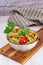 Typical Italian dish of whole wheat fusilli pasta with Genovese pesto