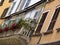 Typical Italian house balcony with flowers