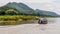 Typical long-tailed boat navigates the Mekong River in Luang Prababang, Laos