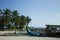 Typical maldivian boats called `Dhoni` in the harbor with palms background