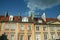 Typical Medieval Facade of an old appartment residential building in a street of old town, the historical center of Warsaw, Poland