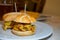 Typical mini burger snack of Basque Country, pinchos or pinxtos, small piece of bread with different toppings, served in bar in