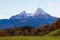 Typical mountain scenery in the background of the famous Watzmann Mountains in beautiful autumn colors near the cozy Berchtesgaden