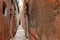 The typical narrow path in Venice, Italy