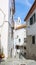 Typical narrow winding street in the Alfama district, Lisbon, Portugal