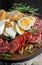 typical Neapolitan dish of the Easter period with salami ricotta salata, tortano, casatiello, provolone and hard-boiled eggs