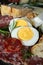 typical Neapolitan dish of the Easter period with salami ricotta salata, tortano, casatiello, provolone and hard-boiled eggs