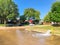 Typical neighborhood area with stop sign near Dallas, Texas, America with open yellow fire hydrant