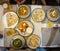 Typical nepalese meal and beer in Pokhara restaurant, Himalayas, Nepal. Assorted indian nepalese food on table. Dishes Nepal