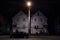 Typical north American wooden houses in a residential street in autumn in Ottawa, Ontario, during an autumn night with cars parked