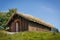 Typical norwegian building with grass on the roof