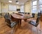 Typical office meeting room, long table and chairs