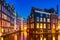 Typical old dutch houses over canal with reflections at twilight in Amsterdam, North Hilland, Netherlands. Amsterdam postcard