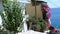 Typical old greek street. Narrow street with atmospheric floral walls. Mediterranean colors and a sense of sunny morning