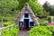 Typical old house of Santana in Madeira Island with a particular thatched roof and a red and white facade Santana, Madeira