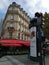 Typical Paris street view building. red light traffic light and advertising