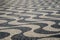 Typical portuguese cobblestone hand-made mosaic pavement and a pigeon, in Rossio Square or Pedro IV Square PraÃ§a de D. Pedro IV