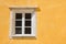 Typical portuguese window against a colored plaster wall