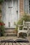 Typical quintessential old English country garden image of wooden chair next to vintage back door concept coming out of pages in