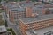 Typical rectangular industrial buildings made of red bricks and vertical windows in the old factory area in Zlin