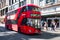 Typical red double decker bus at Oxford Steet in London