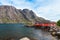 Typical red rorbu fishing hut in village Nusfjord