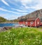 Typical red rorbu fishing hut in village Nusfjord