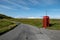 Typical red telephone box or booth in remote area of Isle of Skye, Scotland