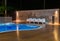 Typical relax zone with swimming pool at a luxury, tropical resort at night