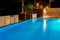 Typical relax zone with swimming pool at a luxury, tropical resort at night