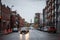 Typical residential North American street with typical brick accomodation buildings & car traffic. Atwater Market Tower visible