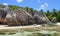 Typical rock formation with traces of erosion on the beach in th