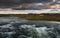 Typical Rural Icelandic house at river Coastline.