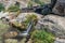 Typical and rustic corner with waterfall on rocks for a natural pool of clear and transparent water in the Serra da Estrela Natura