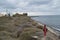 Typical Santorini Bay with Lady in Red and Sea View