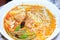 Typical sarawak laksa soup with noodles, green beans, tofu, chic