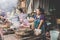 A typical scene of a local hill tribe woman cooking on a barbecue at a roadside stall in Luang Prabang, Laos on the 13th NOVEMBER,