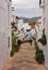 Typical serene street in the town of Frigiliana, Spain on a cloudy day