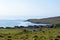 A typical Shetland view, moorland, a litte village and the sea.