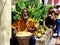 Typical sight in Antigua, a street musician with a lady doing breads