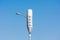 A typical small cell antenna for 5G wireless network installed on lamp post under blue sky