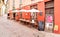 Typical small Italian outdoor wine bar in the historic center of Luino, Italy