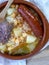 Typical Spanish stew with chickpeas, chorizo, pepper in clay pot