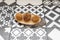 Typical Spanish tapa of round croquettes on wooden plate