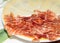 Typical spanish tapa with slices of serrano ham and manchego che