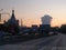 Typical street with asphalt road, cars, buildings and bizarre cloud shape on background, Izhevsk, Russia