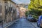Typical street in descent in the city of Siguenza and in the background the hills of Guadalajara. Castilla La Mancha Spain
